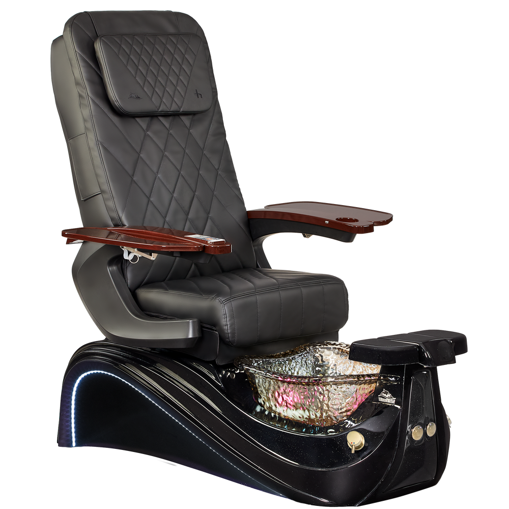 Black pedicure chair with a bowl for water on a white background