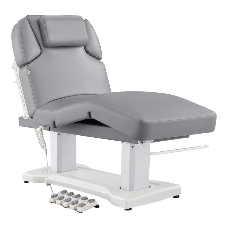 Gray hydraulic treatment table on a white background