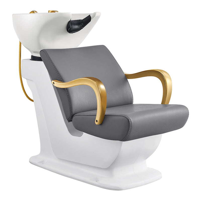 The DIR Beckman Gold Shampoo Unit features gray cushions, gold arms, and a white bowl.