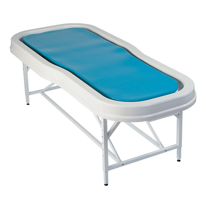 TouchAmerica Neptune Stationary: white hydrotherapy table with blue cushion, sturdy metal legs.